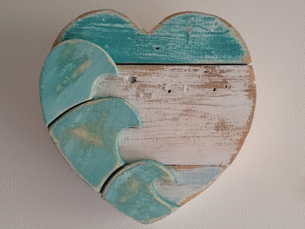 Handcrafted driftwood heart art with layered waves by Sun Kissed Crafts.
