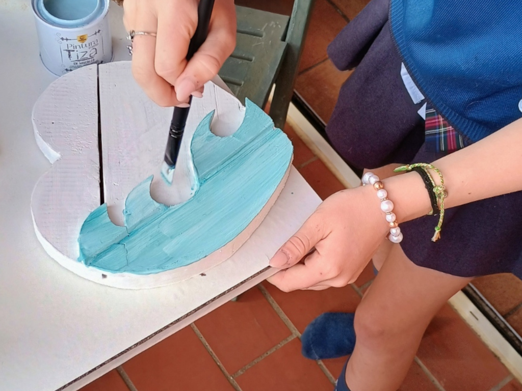 Handcrafted driftwood heart art with layered waves by Sun Kissed Crafts.