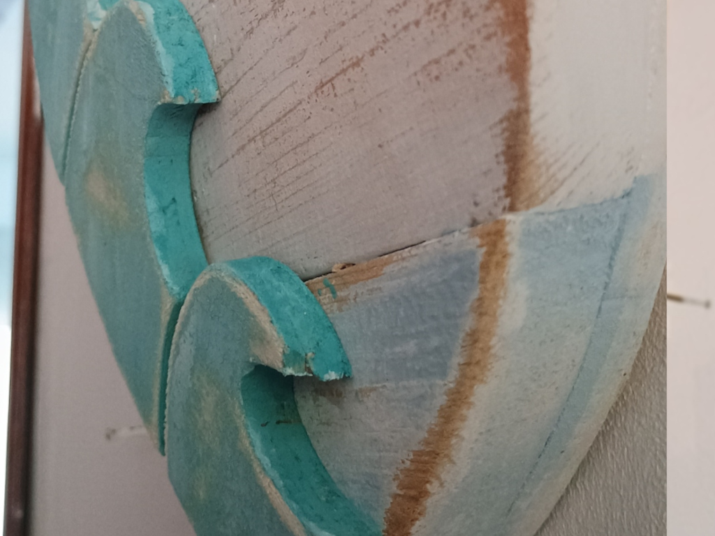 Handcrafted driftwood heart art with layered waves by Sun Kissed Crafts.