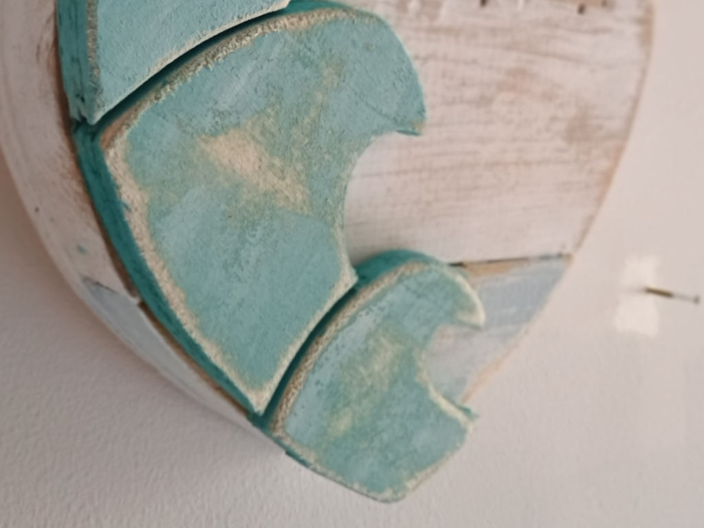 Handcrafted driftwood heart art with layered waves by Sun Kissed Crafts.