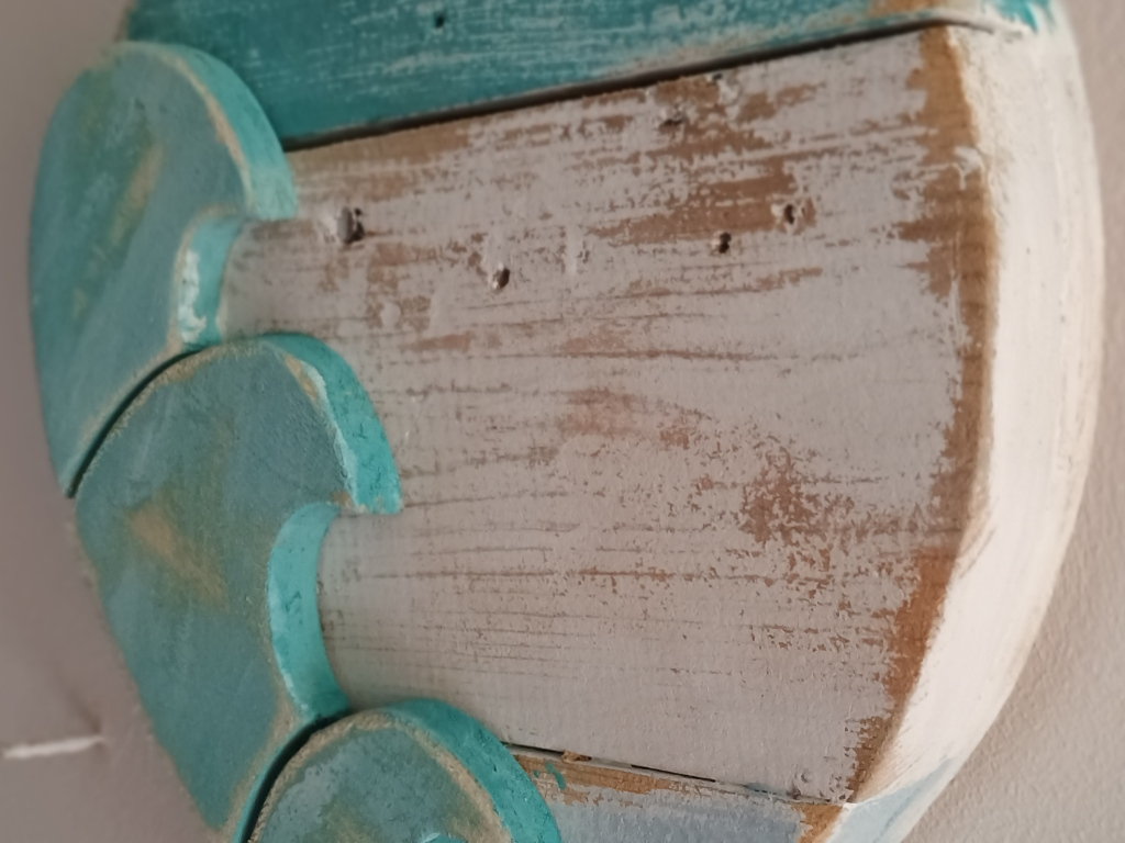 Handcrafted driftwood heart art with layered waves by Sun Kissed Crafts.