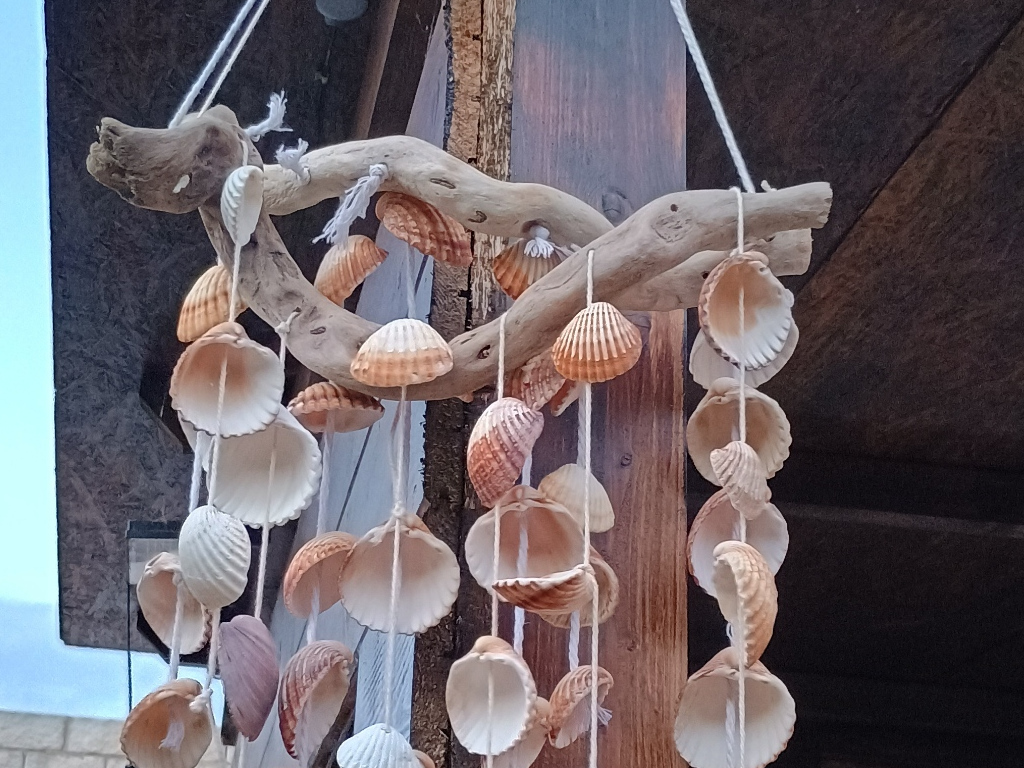 Handcrafted driftwood heart art with layered waves by Sun Kissed Crafts.