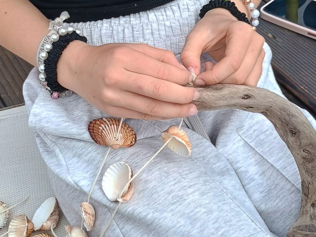 Handcrafted driftwood heart art with layered waves by Sun Kissed Crafts.